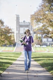 Caucasian student on cell phone on campus