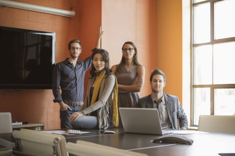 Businesspeople smiling in meeting