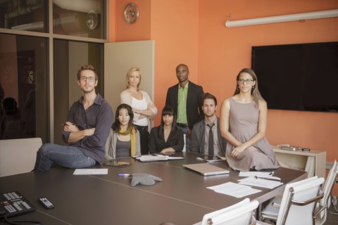 Business people smiling in meeting