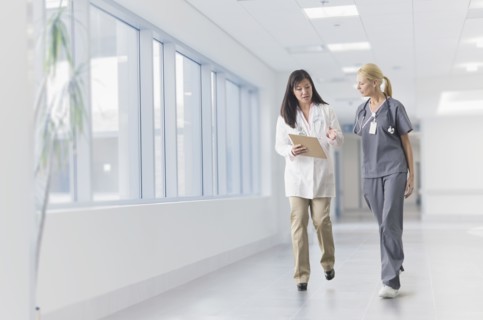 Doctor and nurse talking in hospital