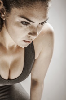 Caucasian woman resting after workout