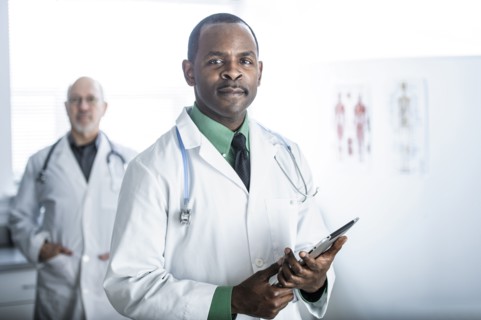 African American doctor standing in office