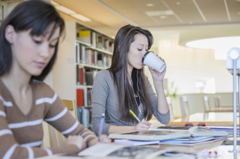 Students working at desk in library