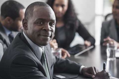Businessman smiling in meeting
