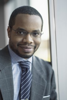 Mixed race businessman smiling
