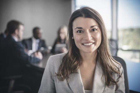 Businesswoman smiling in conference room