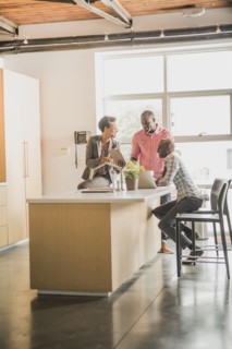 Business people relaxing in office kitchen