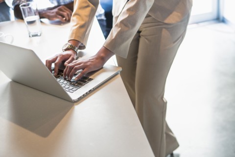 High angle view of businesswoman using laptop in office