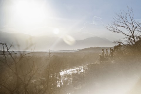 Mountains over river in rural landscape