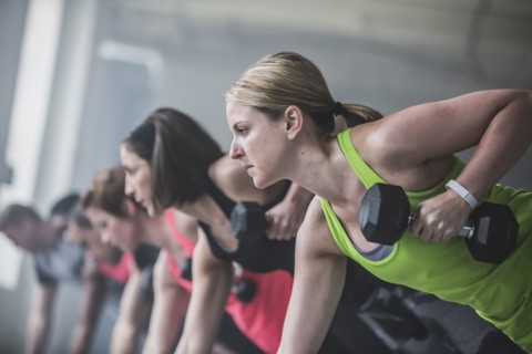 Athletes doing push-ups and lifting weights