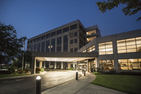 Illuminated driveway of hospital at night