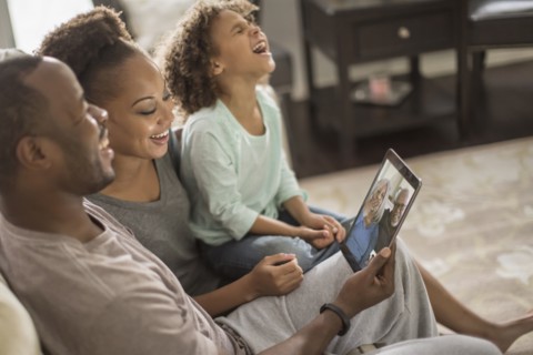 Family video chatting with digital tablet
