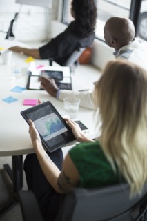 Businesswoman using digital tablet in office meeting