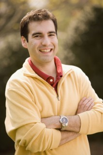 Hispanic man with arms crossed