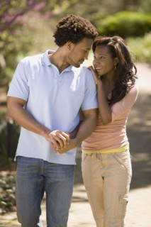 African American couple holding hands