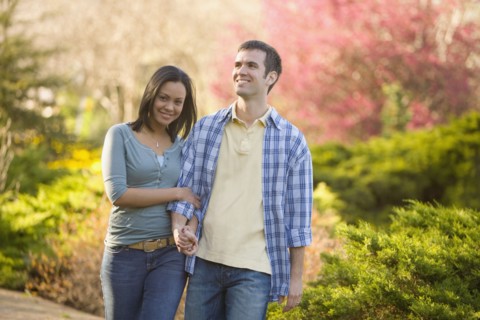 Hispanic couple holding hands