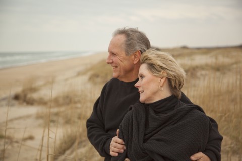 Caucasian couple standing on beach