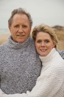 Caucasian couple hugging on beach