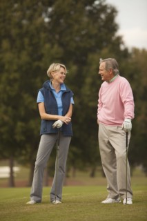 Couple standing on golf course