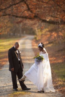 Bride and groom standing on path