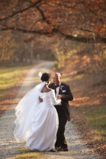Bride and groom standing on path