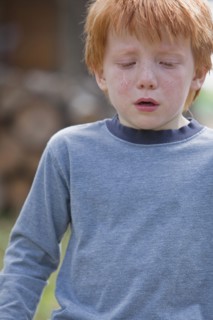 Caucasian boy crying
