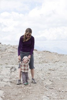 Caucasian mother and baby in rocky landscape