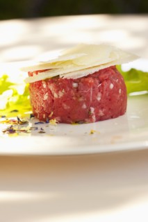 Parmesan cheese atop steak tartare