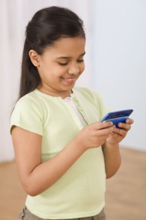 Hispanic girl using cell phone