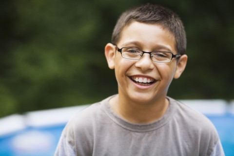 Smiling mixed race boy in eyeglasses