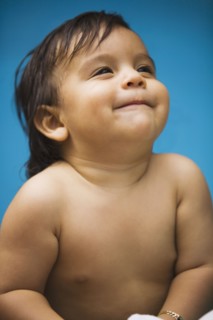 Close up of smiling Hispanic baby boy