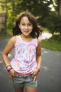 Mixed race girl walking on road