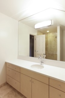 Mirror over sink in modern bathroom