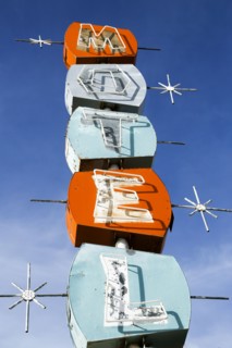 Old-fashioned motel sign under blue sky