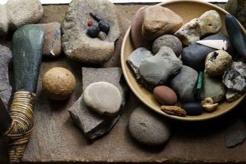 Stones in bowl and traditional tools