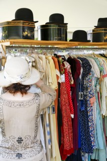 Woman shopping for dress in store