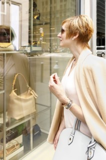Glamorous Caucasian woman window shopping