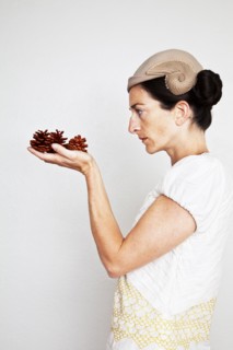 Caucasian woman holding pinecones