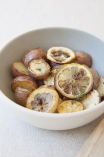 Potatoes and lemon in bowl