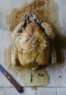 Roast chicken on cutting board