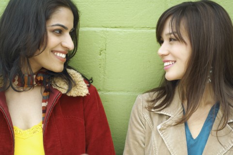 Young women looking at each other