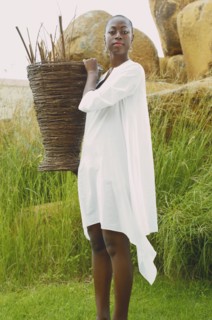 African American woman carrying basket outdoors