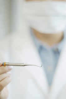 Close up of dental tool in dentist's hand
