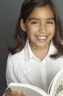 Hispanic girl holding book
