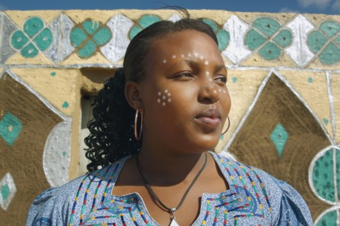 African woman with paint on face