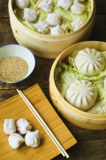 Asian dumpling in steamer with cabbage