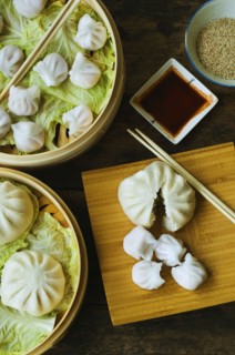 Asian dumpling in steamer with cabbage