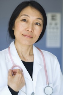 Japanese doctor standing in office