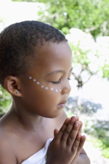 Mixed race girl praying