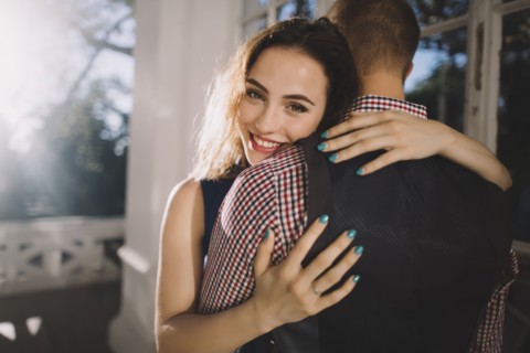 Smiling Caucasian couple hugging